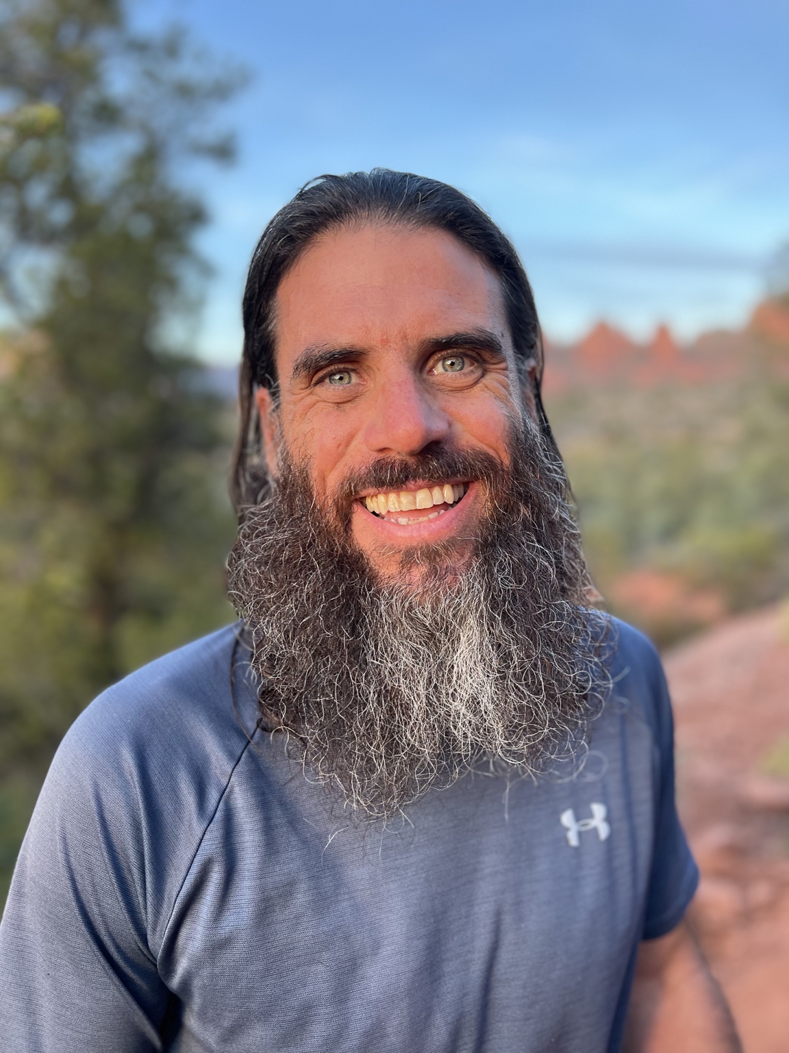 Dr. Kareem F. Samhouri smiling outdoors in Sedona, Arizona